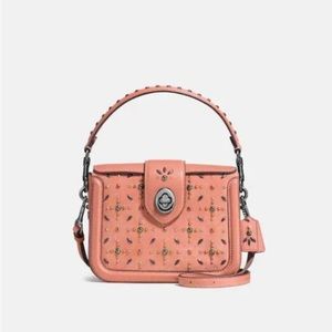 Coach leather rose pink rivet handbag with handle and studs